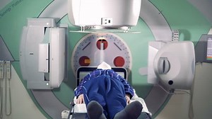 A man is getting radiated by a linear accelerator