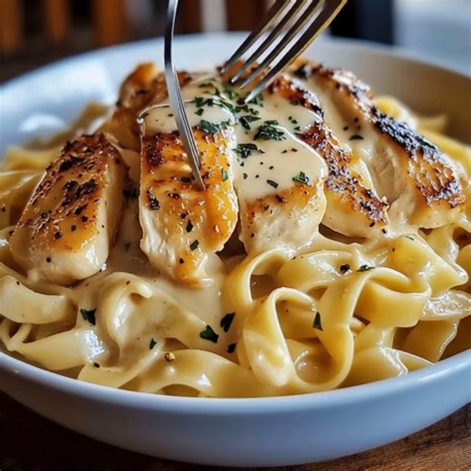 Chicken with Buttered Noodles A comforting and simple dish featuring tender chicken and buttery, seasoned noodles - a perfect weeknight dinner! Ingredients: - 2 boneless, skinless chicken breasts - 1 tsp garlic powder - 1/2 tsp paprika - Salt and pepper to taste - 2 tbsp olive oil - 8 oz egg noodles or your favorite pasta - 3 tbsp unsalted butter - 1/4 cup grated Parmesan cheese - 1 tbsp chopped parsley (optional) Directions: 1. Cook the Noodles: - Bring a large pot of salted water to a boil. - 