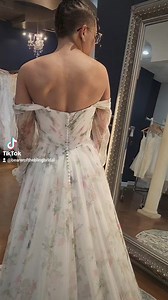 Looking for print? We've got you! This beautiful French netting dress is shown in print, but is available in plain ivory. Slit is optional and the sleeves are removable. Call 727-534-0234 to book your appointment. Save 20% at your first appointment. #love #fairygownmother #dressshopping #planning #bridetobe #bride #weddingdresses #bridalshop #letsgetmarried #letsgetmarried #stunning #stpetersburg #tampabay #floral #floralprint #floralprintdress #florida | Bearer of the Bling Bridal | Facebook