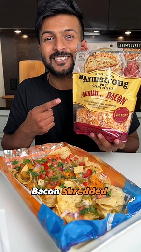 Easy Nachos using mmm…bacon shreds using @armstrongcheese Ingredients: Bag of tortilla chips (chips of your choice) Cheese (mmm…bacon shredded cheese) Onion, chopped Tomatoes, diced Olives, sliced Pickles, sliced Parsley to garnish Instructions: Start by melting the cheese in a pot, until it’s smooth and creamy. While the cheese is melting, keep the tortilla chips in their bag. Carefully cut open the top of the bag, creating an opening for your nacho toppings. Make sure not to cut too much; you 