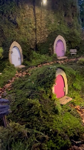 Maryinthefairyland on Instagram: "Here’s a short DIY on how I built the fairy door village 😊 I used one of my kits to create the fairy doors and lanterns, coloring and sealing them to make them weatherproof for outdoor use. For the base, I shaped the landscape with clay-based soil, added moss for a magical touch, and used wood chips to craft a whimsical path. Finally, I completed the scene with some charming accessories 😎 What would your fairy village look like? Let me know in th