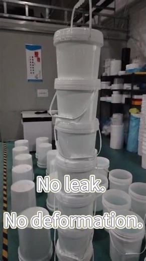 Plastic buckets fully filled with water, stacked in 10 layers.