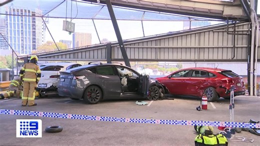 The South Melbourne Market car park has been closed after a Tesla driver lost control and smashed into two cars leaving one shunted over the edge of the building. A woman was taken to hospital while the motorist is set to be fined. #9News | WATCH LIVE 6pm | 9 News Melbourne
