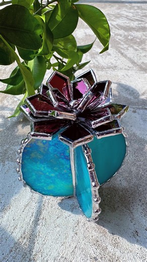 STAINED GLASS ART JEWELRY / 3D ORCHIDS & FLOWER MIRRORS on Instagram: "Making solder beads for turquoise & rose cactus . #stainedglassart #glassflower #cactus #waterlily #houseplants #weddinggift #weddingdecor #succulents #tropicalflowers #stainedglassartist #stainedglassflower #stainedglasscactus #tabledecor #everlastingflowers"