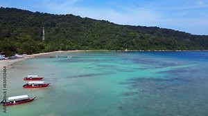 Wonderful aerial view flight . Stunning aerial view of a serene tropical island coastline with lush forests, clear waters, and a pristine, secluded beach. overflight flyover drone