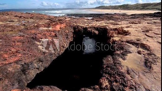 Forrest Caves with beautiful red rocks formation on coastline of Phillip Island, VIC Australia. It is a natural sightseeing attraction and beach walking trail near Melbourne.