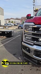 2023 Ford Motor Company F550 upfit featuring a DuraMag Bodies 12' aluminum dump body, 11' dual acting scissor hoist, Buyers Products Company electric load cover, stainless steel underbody boxes, stainless steel retractable truck steps, Whelen Engineering Company, Inc. emergency lights, lightbar, and Phoenix USA stainless steel fenders. #worktruck #strobes #dumptruck | Hartford Truck Equipment, Inc.