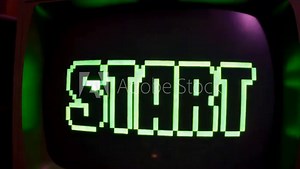 A vintage gaming console displays the word START in bright green pixels, inviting players to begin their nostalgic gaming adventure in a retro setup.