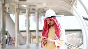 Islamic man using smartphones app organize schedule agenda focus on hands holding smartphone muslim modern uae city. Arab men wear hijab and muslim formal dress sending text sms online lifestyle