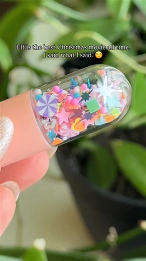 Okay but WHAT is the reindeer at the end wearing 🤣 He wants to feel Bonita I guess 💅🏼 This Reindeer Poop Chill Pill is already sealed too 😂 it reminds me of those little water games where you press the button & it shoots the tiny hoops up through water & you have to catch them on these little sticks 😅 | Chill Pill Charms