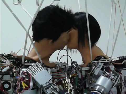 Humanoid robots Thomas and Janet rehearse kiss scene