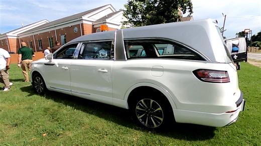 Willie A Watkins Funeral Home silver over white '22 MK Coach Company Lincoln Grand Legacy Limited walk around prior to National Funeral Directors and Morticians Association, Inc. Atlanta convention. #funetorium #funeralfinds #funeralhistory #funeralhome #funeral #funeralcoach #coachbuilt #mkcoach #lincoln #grandlegacy #legacy #limited #hearse #procar #ohio | Funetorium