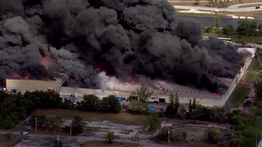 VIDEO: Massive warehouse fire is sending thick black smoke in Miami Gardens