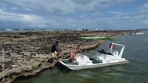 Brazilian taxi boat riding through Baja Sao Miguel. Drone 4k Brazil Ocean