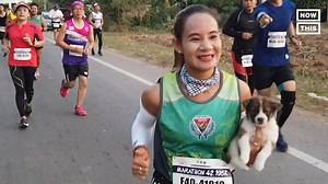 Good morning! This marathon runner picked up a stray puppy at mile 7 and carried her past the finish line. | NowThis Daily