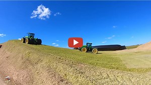 Mike Less - Farmhand Mike -- Video from a dairy farm near Rockford Ohio as they finish off building the second corn silage pile of the season
