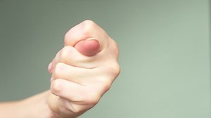 clip-1018582171-beautiful-female-hand-elegant-manicure-shows-sign