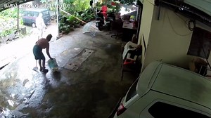 Pensioner sweeping her driveway survives landslide that engulfs her home