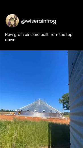 Wise Rain Frog on Instagram: "This shows the process of constructing a grain bin using a top-down method with a hydraulic jack system. Instead of building the structure from the ground up, the roof and top ring are assembled first. Then, the entire structure is slowly lifted using jacks, and new rings are added underneath as it rises. This method ensures safer working conditions by keeping construction at ground level and makes it easier to maintain the bin’s structural alignment. Grain bins lik