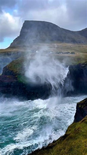 Múlafossur in Gasadalur, Faroe Islands, was having a moment 😅�A storm gust hit the waterfall and created this vortex — wild weather is where the magic happens. Would you dare to head out in weather like this 😅 📽️ Felixinden / Felix Inden Photography | Visit Faroe Islands