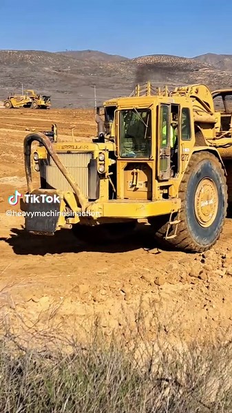 CAT 834B Wheel Dozer and 657s at Work