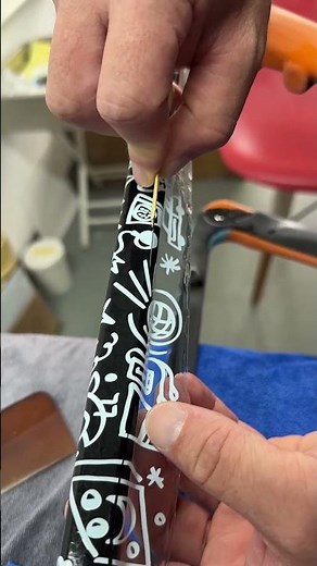 Applying Custom Decals on a The orange & black graffiti gravel frame.#icancycling #graro