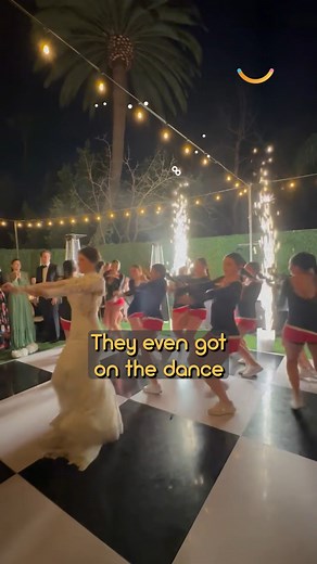 This cheer coach was surprised by her entire squad on her wedding day 🫶 #wedding #weddingday #cheerleading | Happily