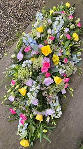 110K views · 5K reactions | Creating meaningful tributes, one flower at a time. Today we’re sharing the artistry behind creating this peaceful tribute spray. Watch our Timelapse as layers of yellow roses, pink spray roses, and ethereal blue delphinium blend with delicate greenery to tell a story of love and remembrance. Each bloom chosen with purpose, arranged with grace.  #FloralArtistry #GardenInspired #SimplyFlowers #FuneralTribute #FuneralFlowers | Simply Flowers | Facebook