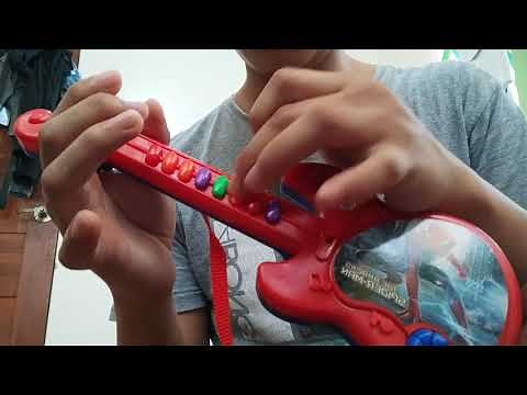 Pirates of the Caribbean song played on toy guitar