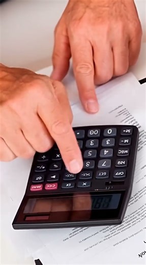 Man using calculator | Free Stock Video Footage 9:16 | AI GENERATED