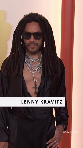 Lenny Kravitz stuns in bold red carpet look