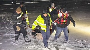 Man injured in snowmobiling accident rescued after hours in the snow