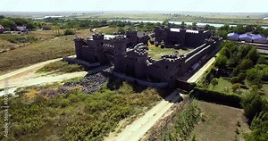 Side view from above of the castle and the surrounding area. Restoration of the castle. Construction of the castle in our time.