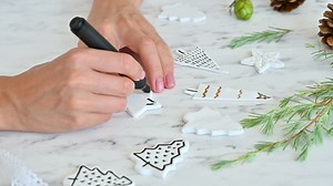 Free stock video - Female hands decorate ornaments with star shape using a marker pen