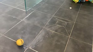 Water pools on the floor and doesn’t flow to the drain. Apart from expensive renovations of the entire floor, is there anything I can do? (Video shows lowest point)
