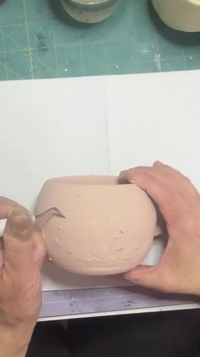 This is my first try using a vinyl decal cut from my cricut. The plan is the glaze will leave a nice pattern after it comes out of the kiln. That’s if the glaze isn’t too runny. Fingers crossed 🤞 #experiment #cricut #pottery #mugs #ceramics #lotus #ceramics | Michelle Potter Artist