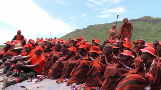 Cultural Gathering in Red and Black Attire