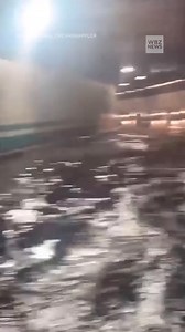 Video shows cars driving slowly through the Ted Williams Tunnel after torrential rain hit Boston on Wednesday. | WBZ / CBS News Boston