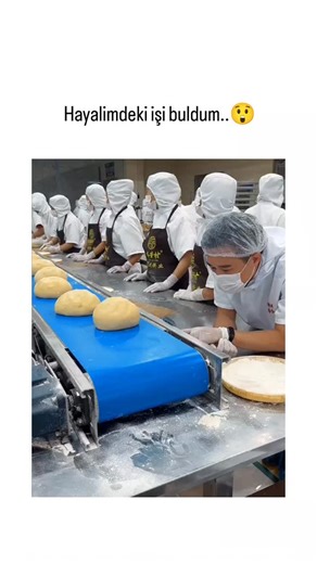 Vicky__hubs on Instagram: "The post ironically celebrates finding a "dream job" via a video of repetitive mooncake production in a Chinese factory, using excited emojis to highlight the sarcasm of monotonous assembly-line work. Footage captures workers in hairnets and masks shaping dough balls, filling pastries with lotus seed paste, and packaging them into red tins, emphasizing industrial efficiency over creativity. Replies mix humor and sympathy, with users joking about the job's boredom and e