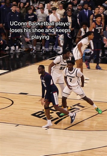 Is this a normal thing in basketball???? UConn basketball player loses his shoe in the middle of play, and continues on like normal. Then the shoe gets yeeted back to him out of seemingly nowhere at a stoppage in play #collegebasketball #uconn #sports #funny #basketball