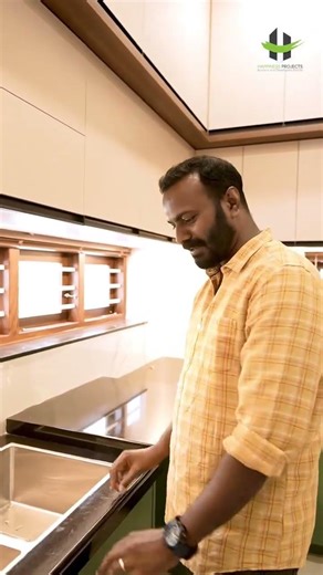 Sleek granite strip at the sink that prevents water from spilling.