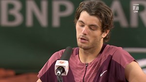 Taylor Fritz chats with Marion Bartolo after his win—but not for long