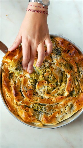 166K views · 186 reactions | Greens and Chickpeas Filo Pie from @bettinas_kitchen this delicate crunch of filo pastry envelopes a filling of rich flavors, textures and spices, creating a dish that’s both wholesome and satisfying is the perfect brunch recipe #brunch #getbrunchin #tastyuk #filopastrie #pie #borek #foodtok #easyrecipe #summerrecipes | Tasty | Facebook