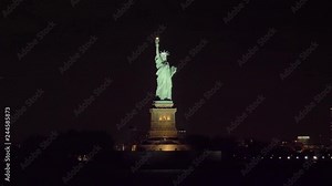 Statue of Liberty at Night in New York City. View from the Water. Orbiting. Medium Shot
