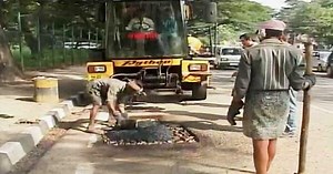 A Python Is 'Swallowing' Bengaluru's Potholes One at a Time |