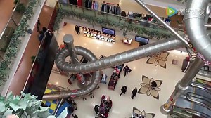 The new slide in a shopping mall in Shanghai for those without the patience to use the elevator or escalator. This looks fun and like it would liven up the shopping experience!! #SlideinShanghaimall | That is China