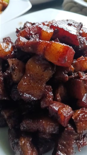 Filipino foods, pork humba, sweet chilli pork and chicken barbecue in a pan.