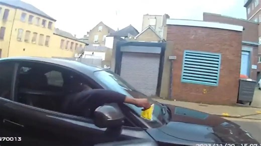 Terrifying moment parking warden shoved to the floor & repeatedly punched