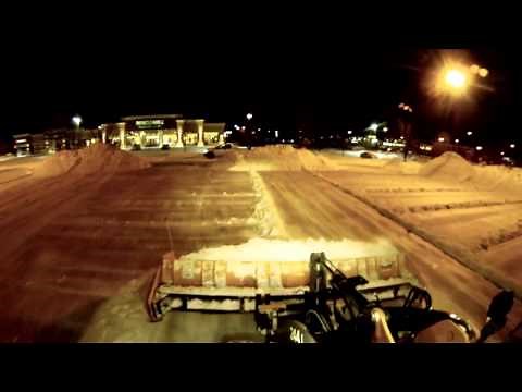 John Deere 244J plowing