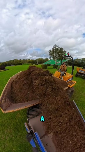 A loader skillfully transfers organic soil into a dumper on the field. #LoaderWork #SmartFarming #EngineeringInAction #fblifestyle | Moisés Stduio